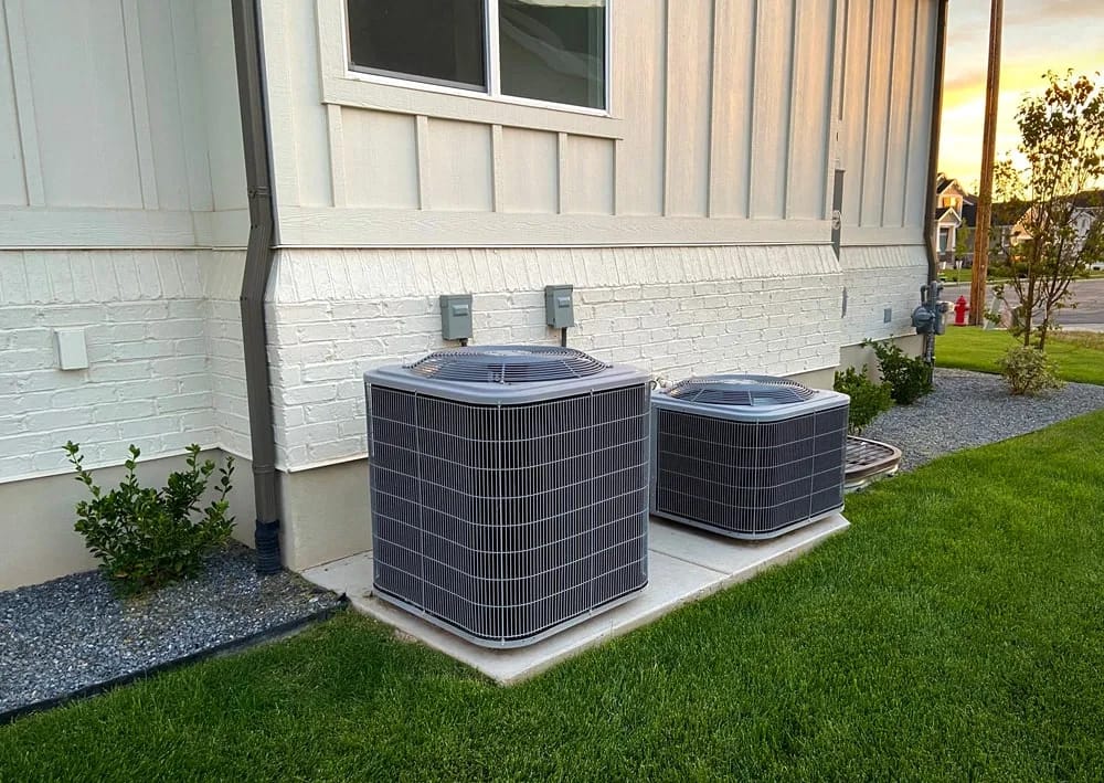 Two AC Blocks Next To A House